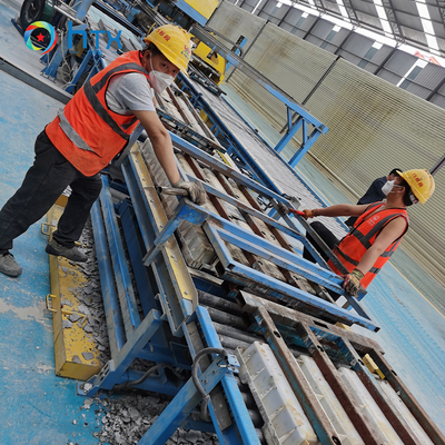 Ligne de production de blocs de maintien en béton